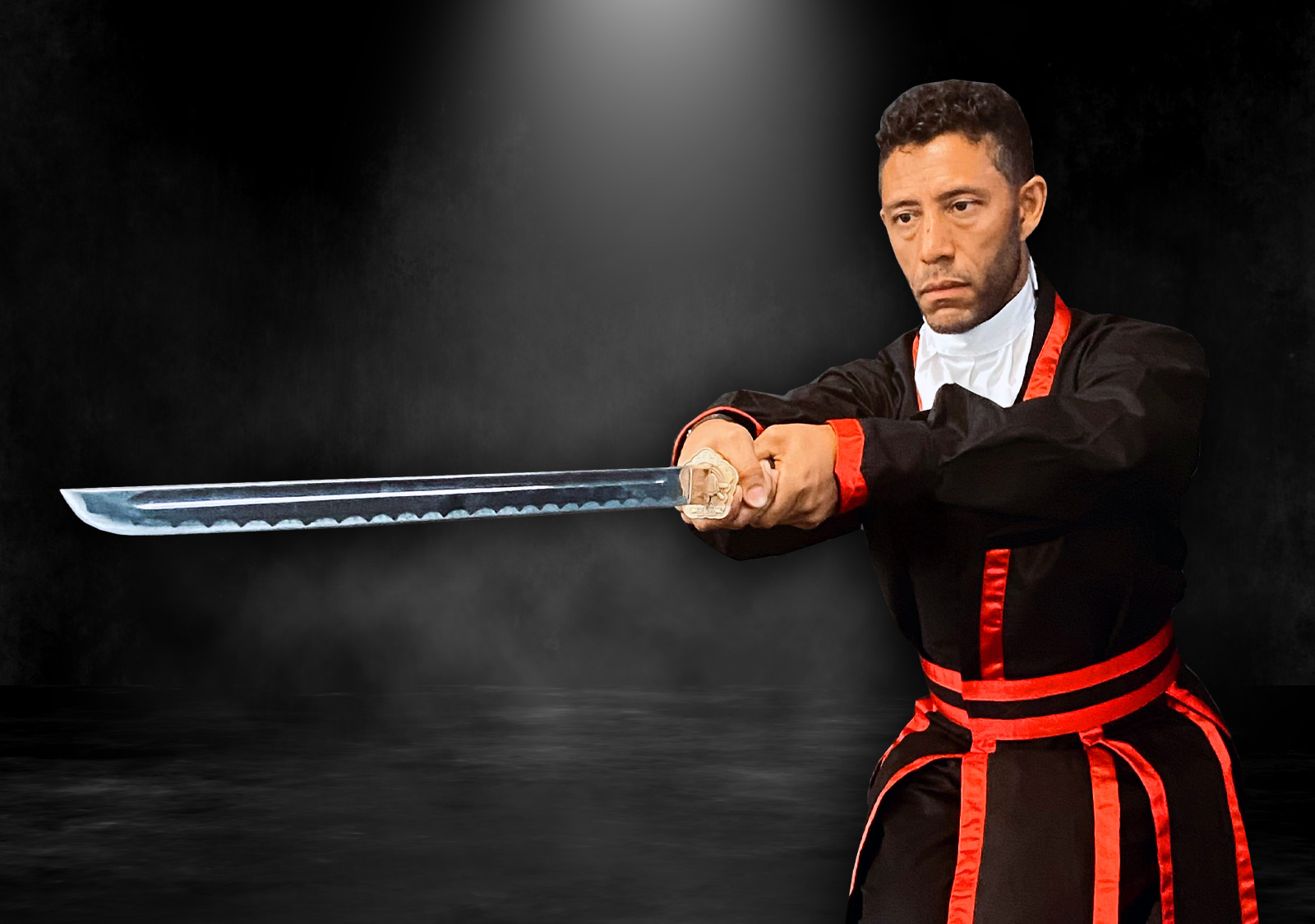 PKJN Nathan, A martial artist in a traditional uniform holds a sword with both hands in a forward stance, staring intently ahead. The scene is in black and white with dramatic lighting and a smoky, dark background.